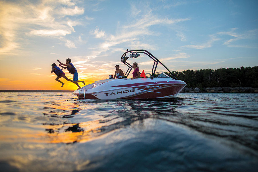 Boat Rentals available on Table Rock Lake at Big Cedar Family jumping into water from a rented boat on Table Rock Lake at Big Cedar
