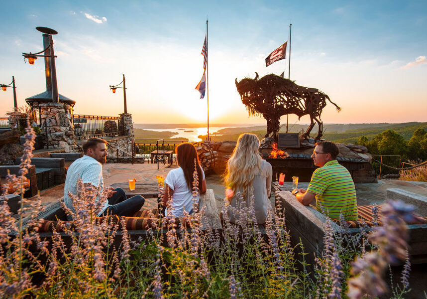 Buffalo Bar dining at Top of the Rock at Big Cedar Couples on the patio at Buffalo Bar enjoying outdoor casual dining with view of the valleys and Table Rock Lake at Top of the Rock at Big Cedar