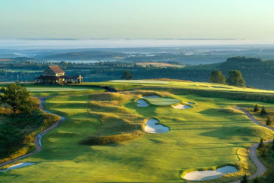 Ozarks National Hole #3 Aerial view of hole number 3 at Ozarks National. Haze covers the lake below in the distance.