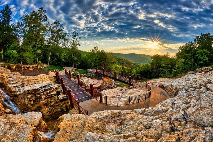 Top-of-the-Rock-Cave-Trail Cave trail carved out of the rock in the Ozark Mountains with vivid sky and sunset